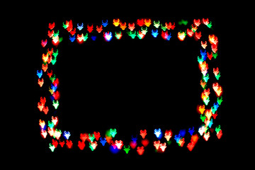 colorful figures with horns form a frame.bokeh figure with horns isolated on black background.frame of figures with horns.