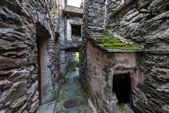 Typical Ticino stone houses in a narrow alleyway in the mountain village of Bordei, Centovalli, Canton Ticino, Switzerland, Europe