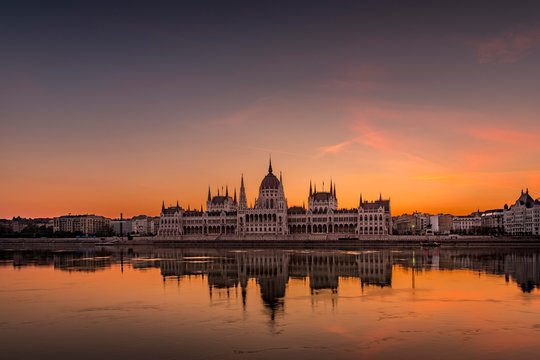 Sunrise with Parliament and water reflection in the Danube, Budapest, Hungary, Europe
