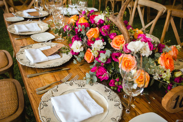 table setup, wedding guest table, reception layout in pantone living coral and deer horns rustic style