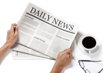 Hands holding the Business Newspaper and glasses and coffee cup isolated on white background, Daily...