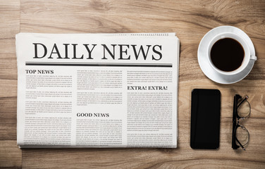 Newspaper with the headline News and glasses and coffee cup on wooden table, Daily Newspaper...