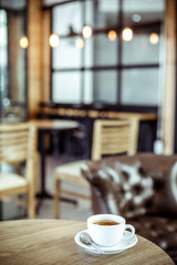Coffee cup in coffee shop - vintage style effect picture