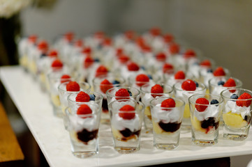Glass shots pastry, wedding catering food, mini canapes food, tasty dessert, Beautiful decorate catering banquet table,  snacks and appetizers, wedding celebration
