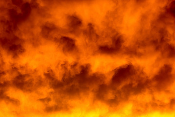 Dramatic orange cloudscape sunset photograph.