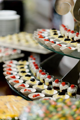 Glass shots pastry, wedding catering food, mini canapes food, tasty dessert, Beautiful decorate catering banquet table,  snacks and appetizers, wedding celebration