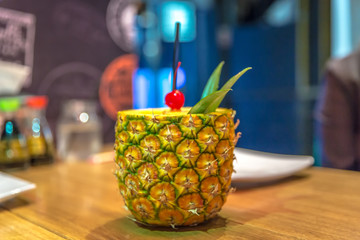 A drink served inside a pineapple