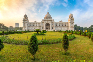 Fototapeta na wymiar Famous Victoria Memorial Kolkata with adjoining garden view at sunrise