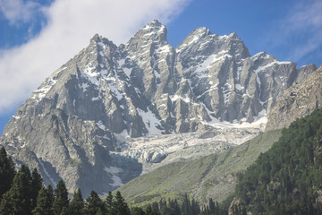 Close-up of a snow-capped mountain peak. A mountain with a glacier in the Himalayas of Kashmir