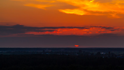 Panoramic view of the horizon and colorful sunset on the outskirts of the city