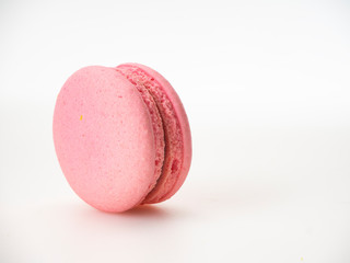 Pink macaroon on white background