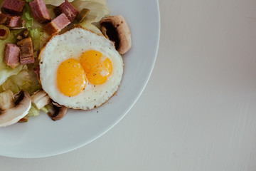 fried eggs with salad
