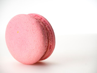 Pink macaroon on white background