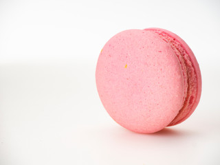 Pink macaroon on white background