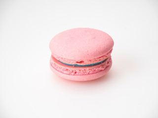 Pink macaroon on white background