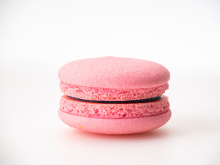 Pink macaroon on white background