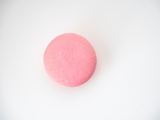 Pink macaroon on white background
