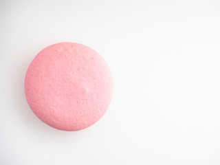 Pink macaroon on white background