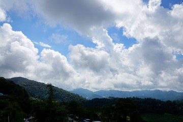 Beautiful landscape on mountain with sky and cloud, peace and relaxation, Beautiful nature to make our mind calm, Mist and green mountains in the background, copy space, Doi Chiang Dao at Thailand