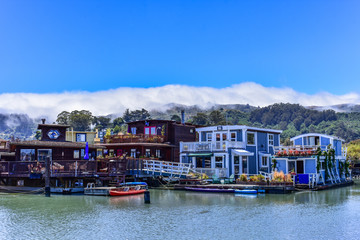 Fototapeta na wymiar Colorful houseboats floating on water