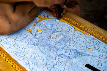 Wood carving in Thailand craftsman.