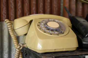 Old telephone with blur background.