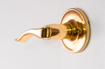 Closeup of golden door handle