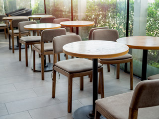 Wooden tables and chairs in cafe