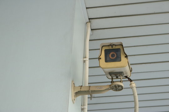 closeup of  old cctv camera on the wall