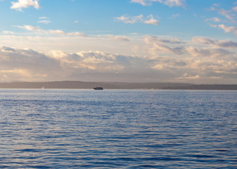 A bote in the distance during sunset