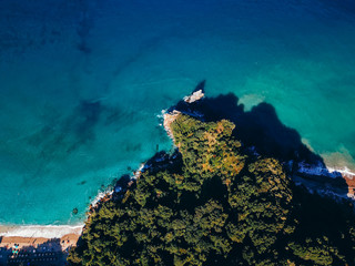 Drone top view of a sea cliff and a beach