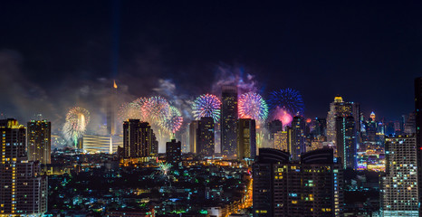 Celebration fireworks in the city at night time. landscape of Bangkok City. Thailand.
