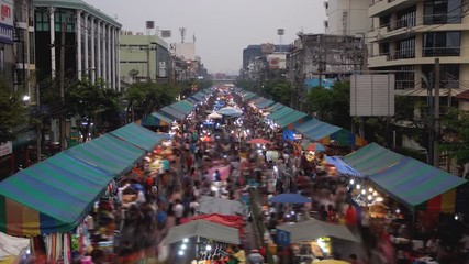 Crowd moving at local market on street, a shopping street festival in Bangkok, Thailand  time lapse
