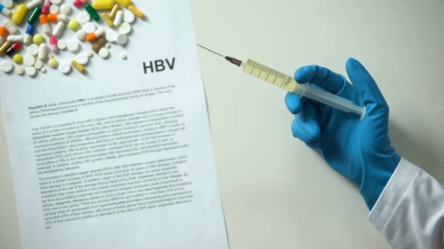 HBV diagnosis on conclusion, hand holding medication in syringe, researching