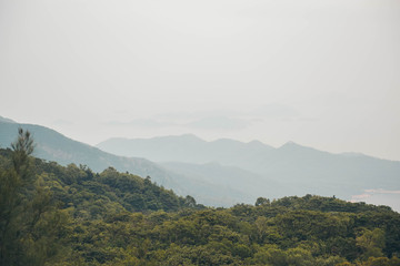Mountain and ocean view in Lantau Island, Hong Kong. Landscape hill scene with fog. 