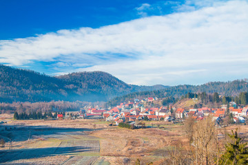 Fototapeta na wymiar Beautiful countryside landscape of town of Lokve in Gorski kotar, Croatia, in winter, panoramic view