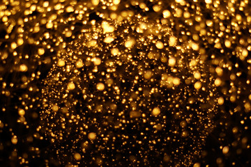 The golden bokeh blurred abstract pattern background.