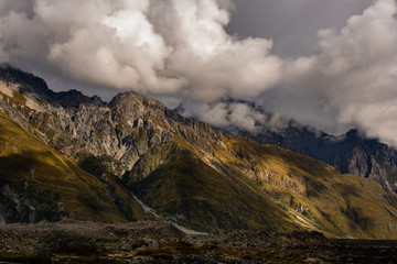 Sun Peaking Out From The Clouds and Onto the Mountain - Tasman Lake New Zealand