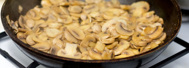 Preparation of mushrooms in a frying pan. Useful nutritious food_