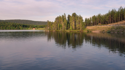 Fototapeta na wymiar Beautiful lake at Lapland.Midnight sun.