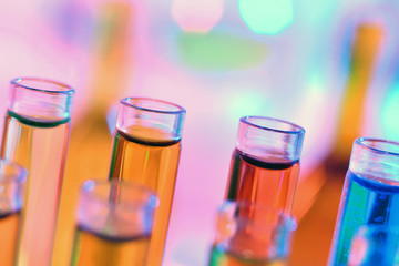 Close up of chemistry test tubes with colorful liquids