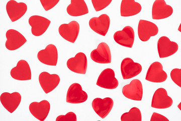 top view of beautiful decorative red hearts isolated on white background