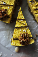 Raw vegan pumpkin cheesecake with walnuts and dark chocolate