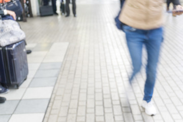 Blurred background of people hurry up walking in train station