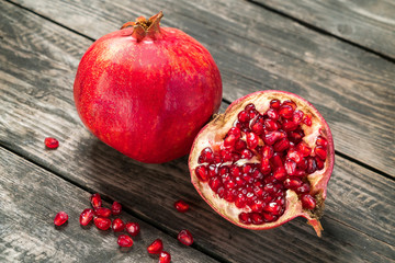 fruits pomegranates on a wooden rustic table