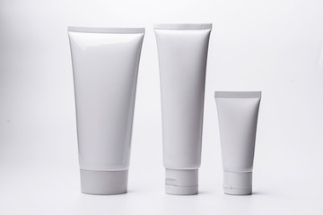 Blank white cosmetic tube isolated on white background.