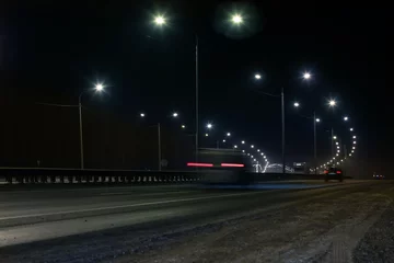 Gordijnen winter highway at night © Yuri Bizgaimer