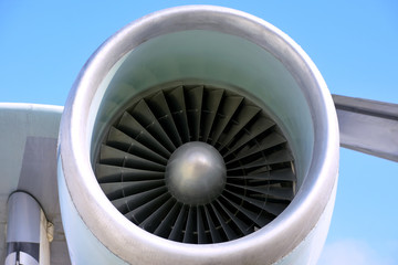 jet engine of an airplane on blue sky background. turbine of an plane with steel blades. Part of...