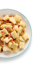 Potato noodles - dumplings on white background
