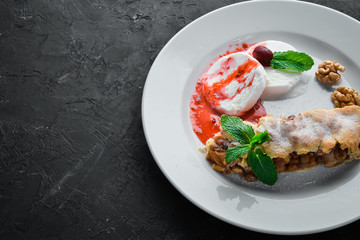 Apple Strudel with Ice Cream and Nuts. Free space for your text. Top view.